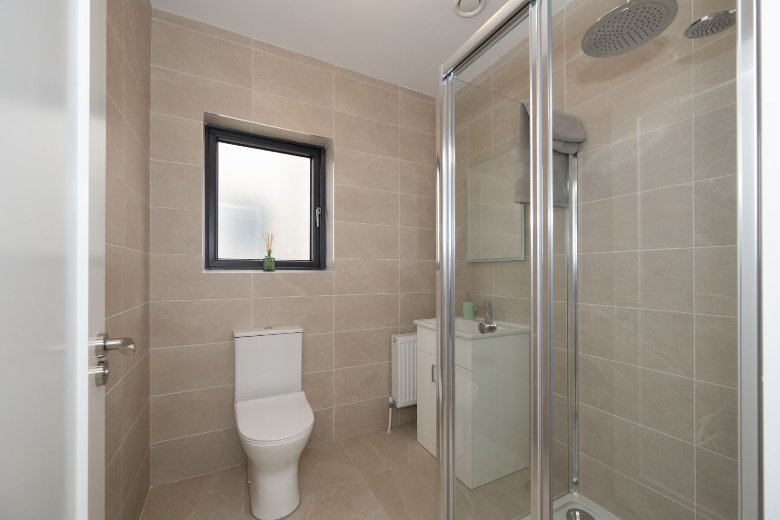 Tiled family bathroom with shower